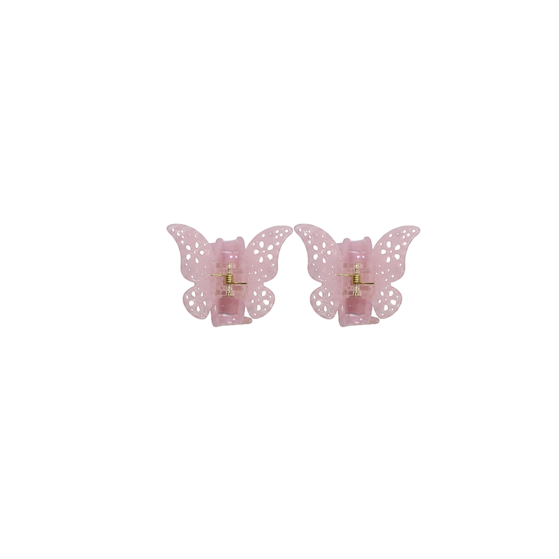 A pair of light pink butterfly-shaped hair claw clips with a perforated lace design and a gold-tone metal center, shown on a plain white background.